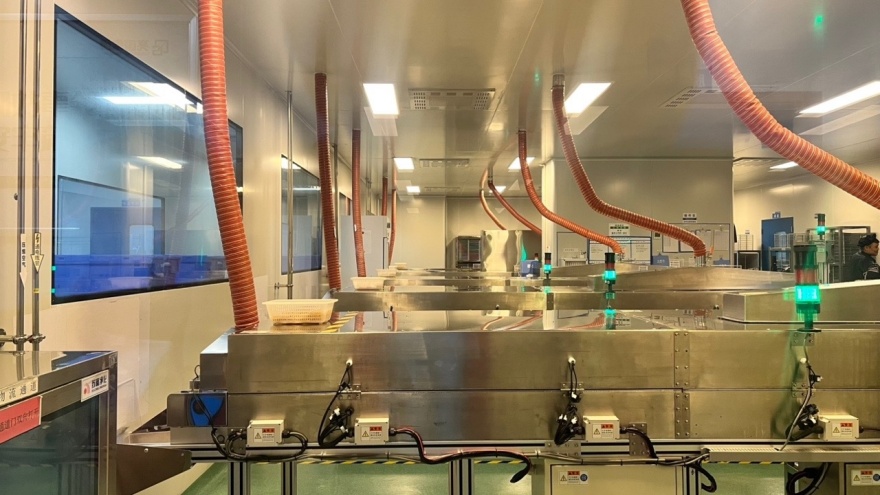 Automated lathe grinding and lens molding line